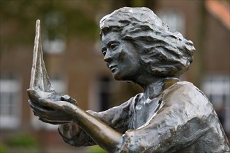 Sculpture Caroline cradles a ship in safety, artist Peters u. Petersen, Carolinensiel, East Frisia,