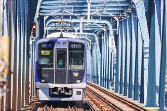 Regional train of the private railway Hanshin Electric Railway in Osaka, Japan, Asia