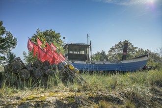 Fishing boat, installation of a fisherman behind the dune, Heringsdorf, Usedom,