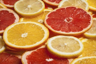 Colorful citrus fruit, lemon, orange, grapefruit, slices background