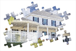 New home within puzzle pieces isolated on white