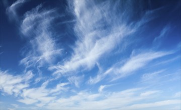 Blue sky with white cirrus clouds