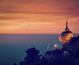 Vintage retro effect filtered hipster style image of Golden Rock, Kyaiktiyo Pagoda, famous Myanmar