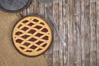 Top view of homemade pie called 'Linzer Torte', a traditional Austrian shortcake pastry topped with