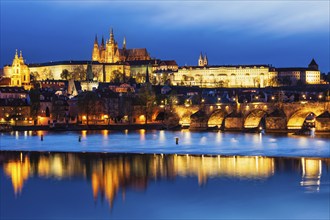 View of Charles Bridge (Karluv most) and Prague Castle in twilight. Prague, Czech Republic, Europe