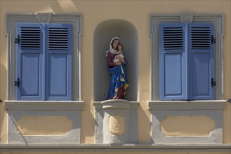 Residential house with Mary's fugue in a niche between two blue shutters, Zeil am Main, Lower