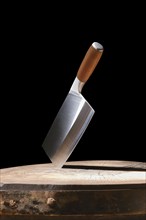 Modern butcher's cleaver is stuck in the stump