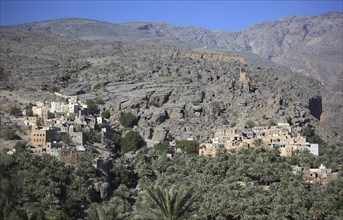 Al-Hamra is one of the many interesting oases with an old mud part with red houses on stone