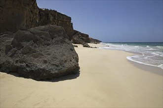 Volcanic rock at Praia de Santa Mónica, sandy beach on the island of Boa Vista, Cape Verde, Cabo