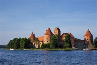 Trakai Island Castle in lake Galve with boats in summer day, Lithuania. Trakai Castle is one of