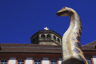 Dinosaur figure in the city centre of Bayreuth, advertising for the primeval world museum in the