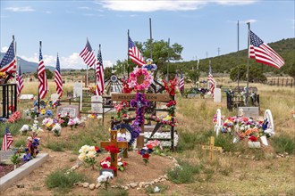 Cerro, New Mexico, A rural cemetery where graves are decorated with flowers and flags