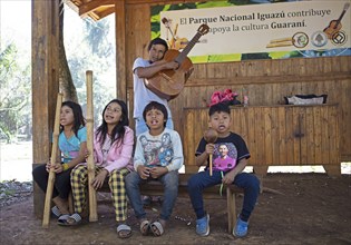 Guarani children playing music in Iguazú National Park, Misiones Province, Argentina, South America