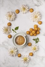 Food photography, coffee cup, with sweets and white dahlias (Dahlia), from above