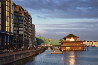 AMSTERDAM, NETHERLANDS, MAY 9, 2017: Sea Palace chinese pagoda styled restaurant on sunset. It is