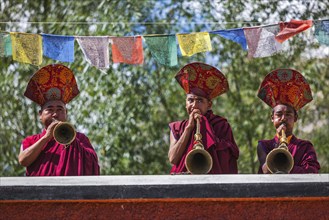 HUNDER, INDIA, SEPTEMBER 6, 2011: Tibetan Buddhist monks playing traditional musical instruments.