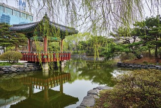 SEOUL, SOUTH KOREA, APRIL 8, 2017: Yeouido Park public park pond with pavilion summerhouse in