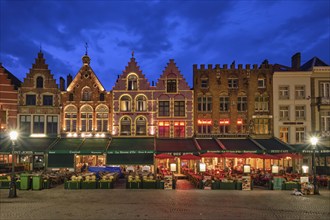 Bruges, Belgium, May 29, 2018: Bruges Grote markt square famous tourist place with many cafe and