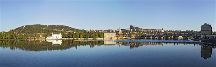 Panorama view of Charles bridge over Vltava river and Gradchany (Prague Castle) and St. Vitus