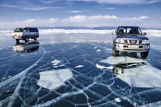 Cars on ice, Lake Baikal, Olkhon Island, Pribaikalsky National Park, Irkutsk Province, Siberia,