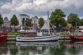 Fishing cutter in the old harbour of Warnemünde, Rostock, Mecklenburg-Western Pomerania, Germany,