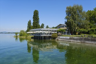 Beach café with reflection on the shore of Lake Constance, Mettnau peninsula, Radolfzell, Lake