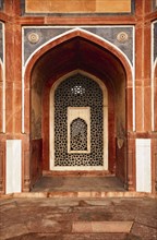 Arch with carved marble window. Mughal style. Humayun's tomb, Delhi