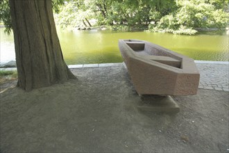 Sculpture Fischernachen by Michael Siebel 2002, boat, canoe, stone, red, Rechneigrabenweiher,