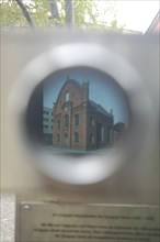 View through binoculars with Jewish synagogue destroyed during National Socialism, Platz der