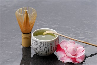 Japanese Matcha tea, 'Chasen' bamboo broom, bamboo spoon and camellia flower, green tea, camellia,