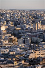 View over houses of Athens in the evening light, Athens, Attica, Greece, Europe