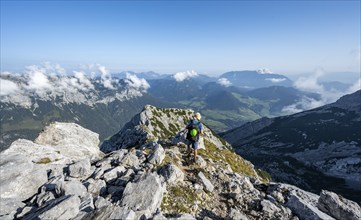 Mountaineer on a rocky path with mountain panorama, mountain tour to the summit of the Hochkalter,