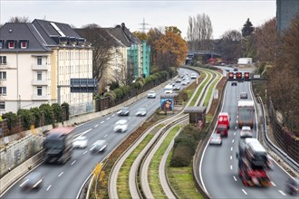 Motorway A40, Ruhrschnellweg, skyline of the city centre of Essen, exit Essen-Huttrop, track bus