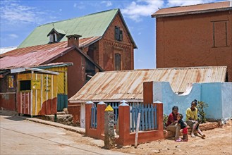 Malagasy girls with child in street in the village Ambohimanga Rova near Antananarivo, Analamanga