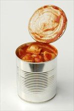 Opened tin of canned food with ravioli in tomato sauce, tin, noodles