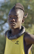 Young Himba boy wearing a traditional headdress, Omohanja, Kaokoland, Kunene, Namibia, Africa