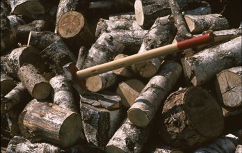 Firewood, logs, sawn into pieces, axe