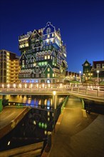 ZAANDAM, NETHERLANDS, MAY 8, 2017: Inntel Hotel in Zaandam illuminated at night. Design of