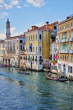 VENICE, ITALY, JUNE 27, 2018: Grand Canal with boats and gondolas on sunset, Venice, Italy, Europe