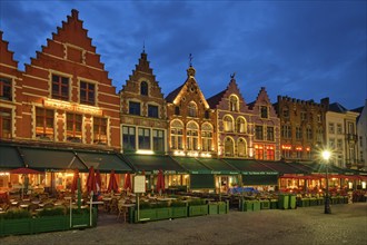 Bruges, Belgium, May 29, 2018: Bruges Grote markt square famous tourist place with many cafe and