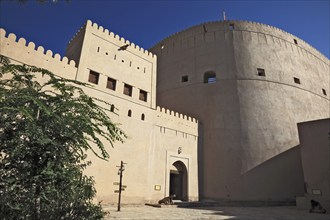 Entrance and fortification at Nizwa Fort. Nizwa is the centre of the Omani heartland. The oasis