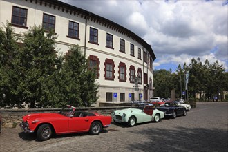 Vintage car parade in front of the castle, round building of Elisabethenburg Castle, Meiningen,