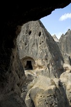 Cave dwelling in tuff rock, Selime, Güzelyurt, Turkey, Asia