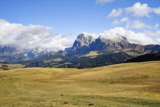 Snow-covered Plattkofel and Langkofel, Dolomites, Alpe di Siusi, snow, clouds and blue sky,