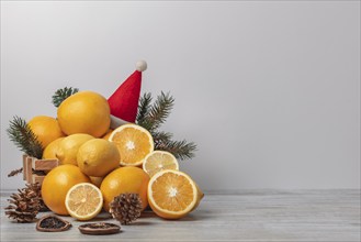 Basket with oranges and lemons, vitamin C, Christmassy, light background, copy room