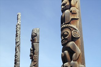 Giant wooden totems, faces, art of the indigenous peoples of Canada, Stewart Cassiar Highway,