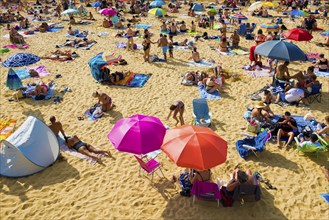 Crowded beach with people in August, San Sebastian, Donostia, Basque Country, Northern Spain,