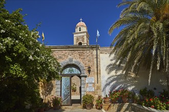 Entrance gate, blue door, bell tower, red dome, palm tree, blue cloudless sky, Toplou, Orthodox