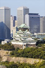 Osaka Castle from above with the skyline skyscrapers in Osaka, Japan, Asia