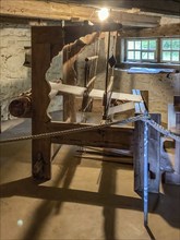 Historical loom in old rebuilt restored small farmhouse weaver's house half-timbered house in